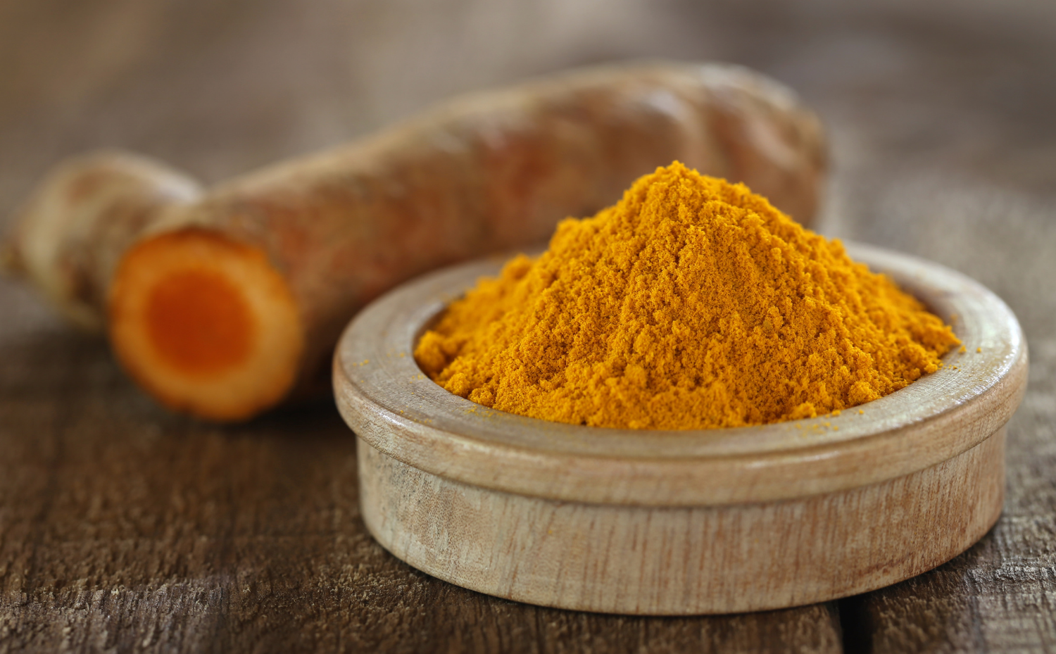 turmeric curcumin root powder in a container