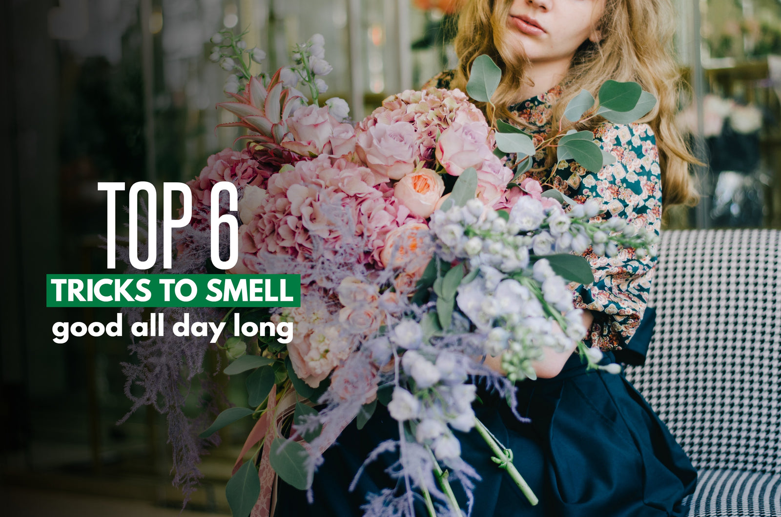 woman holding flowers and smelling them