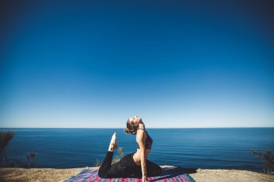 woman doing yoga and thinking about protein