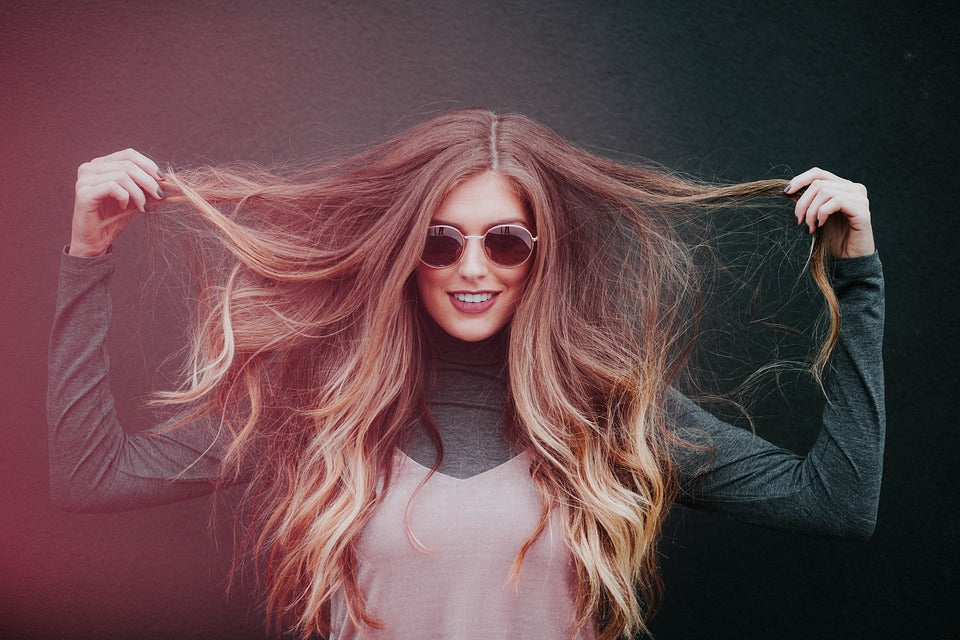 woman showing her long dry hair