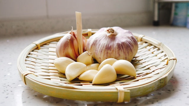 garlic cloves on a plate