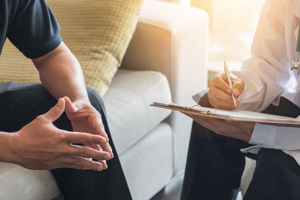 man with a doctor getting health tips for men