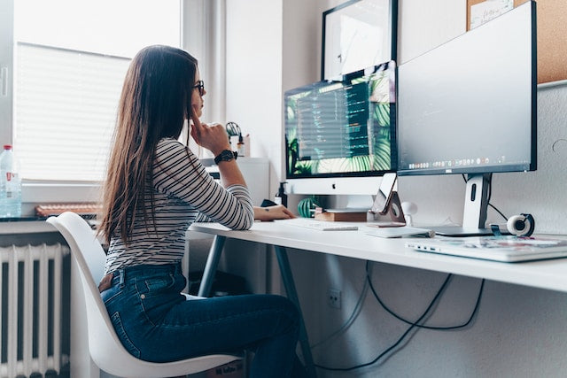 girl using desktop computer in room for remote work