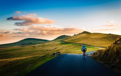 biker riding bicycle in mountains exercise