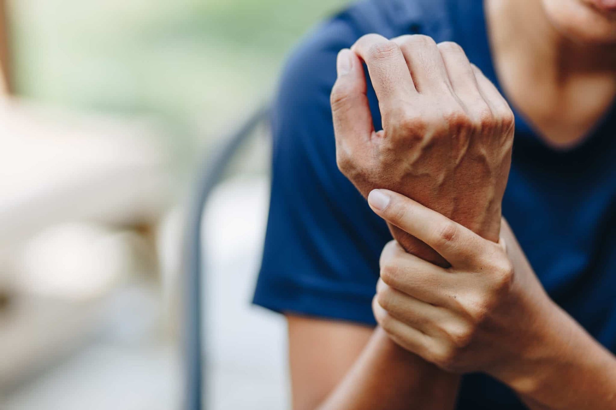woman holding a wrist due to arthritis